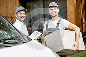 Delivery men portrait near the car