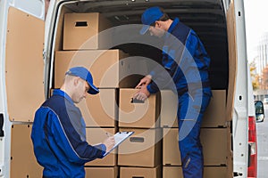 Delivery Men Unloading Boxes