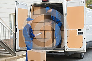 Delivery Men Unloading Boxes