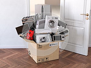 Delivery, moving and online shopping concept. Home household kitchen appliances in open cardboard box in front of open door