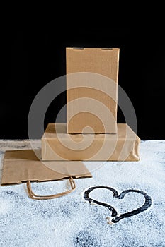 Delivery packing bag box craft pack flour meal heart table black background