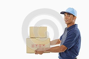 Delivery person carrying cardboard boxes