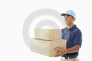 Delivery person carrying cardboard boxes