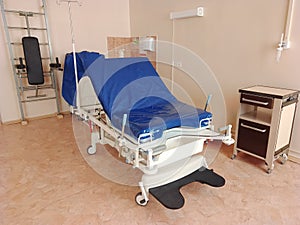 Delivery room with gynecological gurney for childbirth. Modern ward for childbirth