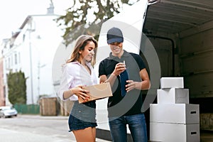 Delivery Service. Courier Delivering Package To Woman Near Car