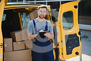 delivery service employee. Portrait of man working in delivery service. Portrait of courier with box. Courier next to