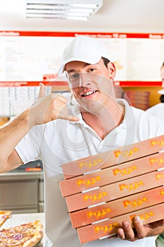 Delivery service - man holding pizza boxes