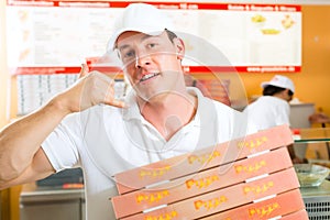 Delivery service - man holding pizza boxes