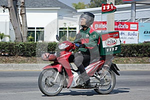 Delivery service man ride a Motercycle of The Pizza Company.