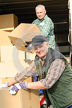 Delivery service mover man cardboard box photo