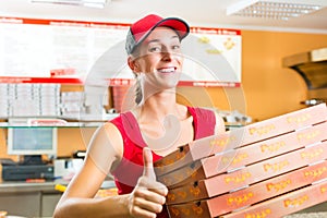 Delivery service - woman holding pizza boxes