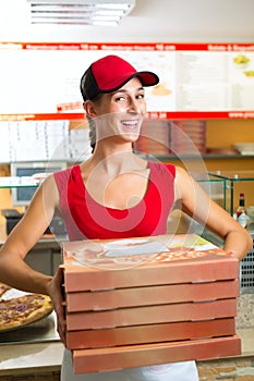 Delivery service - woman holding pizza boxes