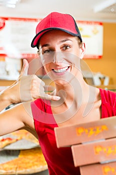 Delivery service - woman holding pizza boxes