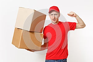 Delivery strong man in red uniform isolated on white background. Male in cap, t-shirt courier showing biceps, muscles