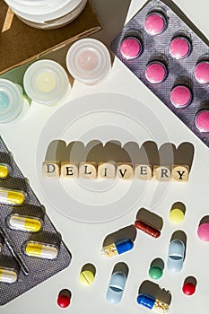 Delivery text surrounded by pills, blisters, medicine bottles.