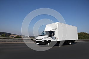 Delivery truck is driving on a street