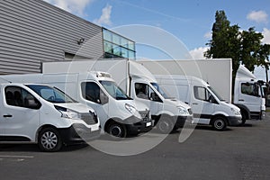 Delivery Trucks Backed Up to A Warehouse Building