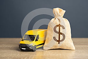 Delivery van and dollar money bag. Supply chain resilience. Invest in electric and autonomous vehicles. Freight transportation.