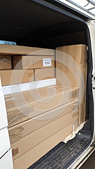 A delivery van neatly packed with parcels and boxes ready for delivery