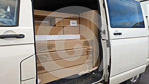 A delivery van packed with parcels and boxes ready for delivery