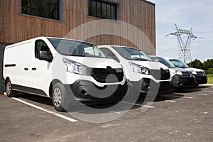 Delivery van small trucks line up park outside