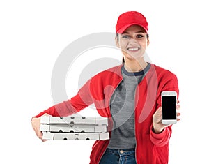 Delivery woman with cardboard pizza boxes and phone on white background