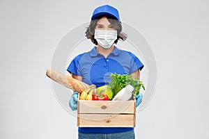 Delivery woman in face mask with food in box