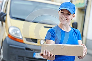 delivery woman with package outdoors. Shipping services