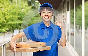 delivery woman with pizza boxes showing ok sign
