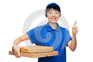 delivery woman with pizza boxes showing thumbs up