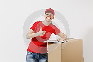 Delivery woman in red cap, t-shirt isolated on white background. Female courier holding filling clipboard with papers