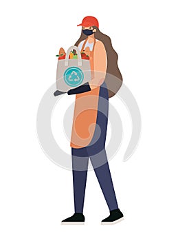 delivery woman with safety mask and one ecobag full of market products on a white background