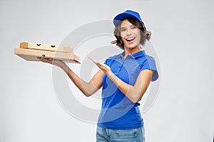 Delivery woman with takeaway pizza boxes