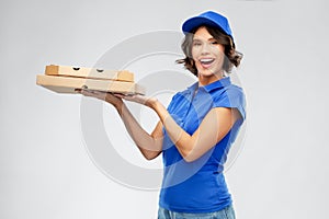 Delivery woman with takeaway pizza boxes