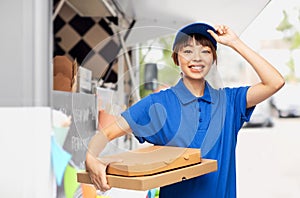 delivery woman with takeaway pizza boxes