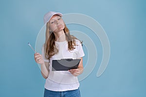 Delivery woman in white uniform isolated on blue background. Girl in white cap