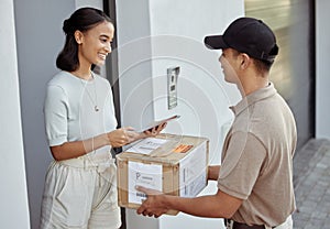 Delivery for you maam. Shot of a young woman signing for an order with a delivery man using a digital tablet.