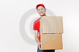Delivery young man in red uniform isolated on white background. Male in cap, t-shirt, jeans working as courier or dealer