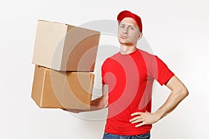 Delivery young man in red uniform isolated on white background. Male in cap, t-shirt, jeans working as courier or dealer