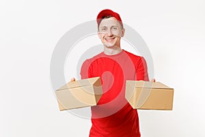 Delivery young man in red uniform isolated on white background. Male in cap, t-shirt working as courier or dealer