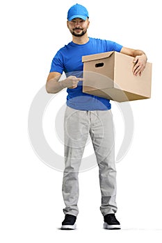 The deliveryman, in full height, on a white background, points to the box