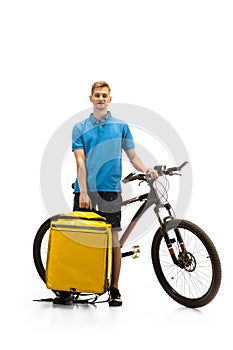 Deliveryman isolated on white studio background. Contacless delivery service during quarantine.