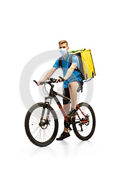 Deliveryman isolated on white studio background. Contacless delivery service during quarantine.