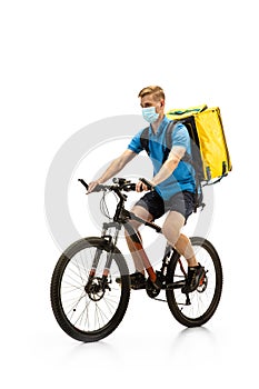 Deliveryman isolated on white studio background. Contacless delivery service during quarantine.