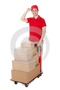 Deliveryman with a trolley of boxes