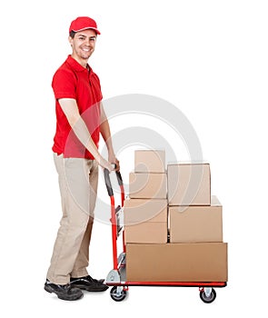 Deliveryman with a trolley of boxes photo