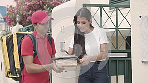 Deliveryman in uniform ringing doorbell