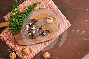 Dellicious homemade chocolate walnut muffin on table. Ready to eat