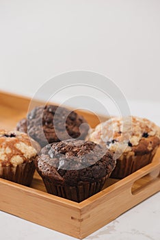 Dellicious homemade muffins on table. Sweet pastries