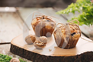 Dellicious homemade nut muffins on table. Sweet pastries